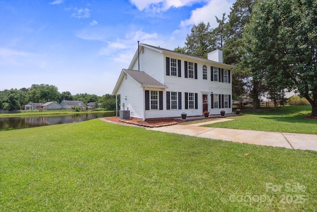 6516 Laurel Springs Ct, Charlotte, NC 28227 - colonial home with a water view, a chimney, and cooling unit