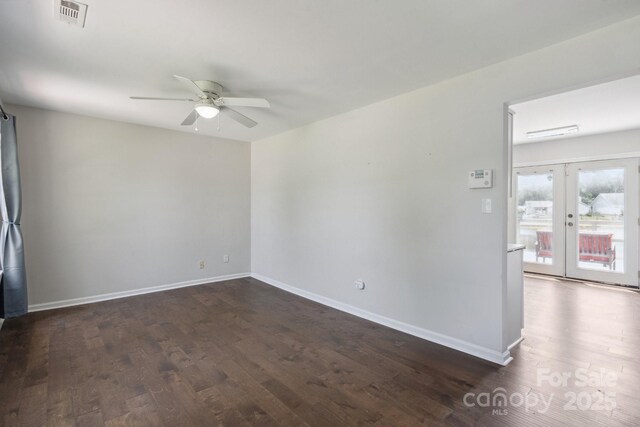 6516 Laurel Springs Ct, Charlotte, NC 28227 - empty room with dark wood-style flooring, a ceiling fan, french doors, and baseboards
