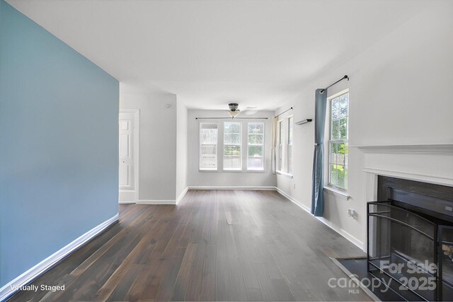 6516 Laurel Springs Ct, Charlotte, NC 28227 - unfurnished living room with wood finished floors, a fireplace with flush hearth, baseboards, and ceiling fan