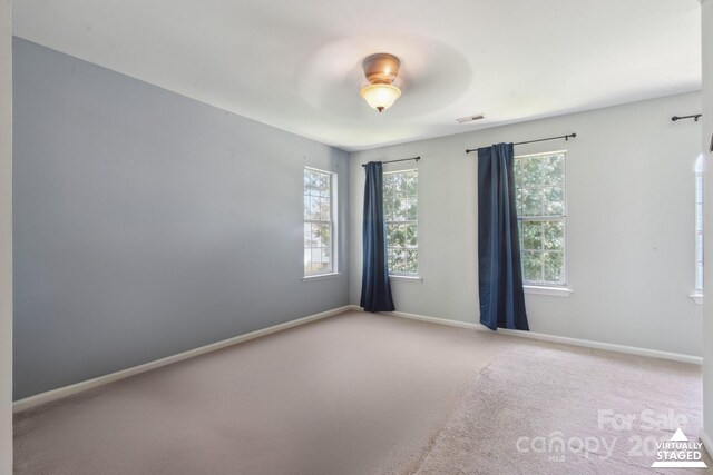 6516 Laurel Springs Ct, Charlotte, NC 28227 - spare room featuring baseboards and carpet flooring