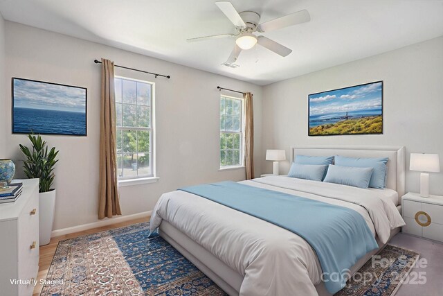 6516 Laurel Springs Ct, Charlotte, NC 28227 - bedroom with ceiling fan, baseboards, and light wood-type flooring