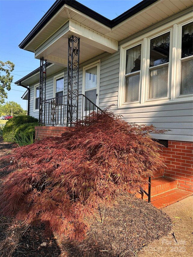 100 S Rudisill Ave, Cherryville, NC 28021 - view of side of home with covered porch and brick siding