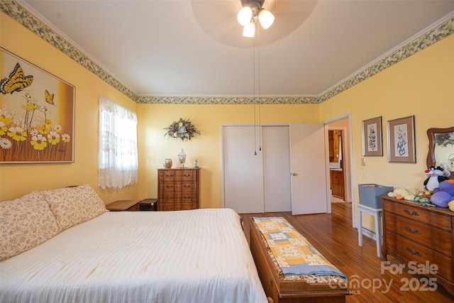 100 S Rudisill Ave, Cherryville, NC 28021 - bedroom with wood finished floors, a closet, and ceiling fan