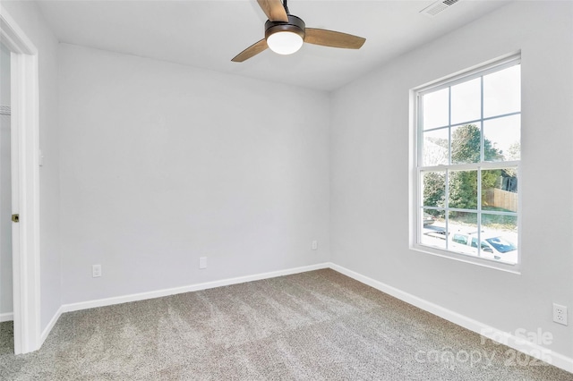 7214 Fox Point Dr, Charlotte, NC 28269 - spare room featuring carpet flooring, a ceiling fan, and baseboards