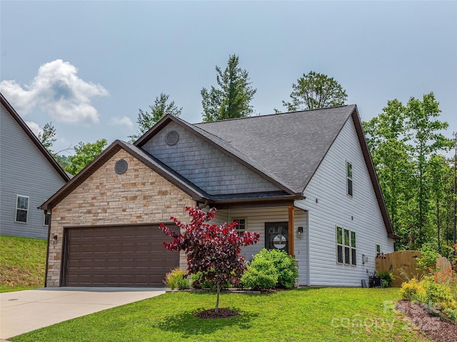 218 Water Leaf Dr, Weaverville, NC 28787 - view of front of home featuring an attached garage, concrete driveway, roof with shingles, and stone siding