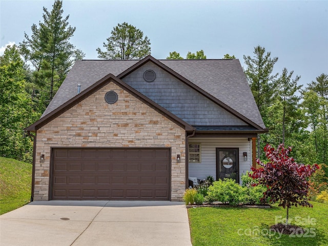 218 Water Leaf Dr, Weaverville, NC 28787 - view of front of home featuring stone siding, roof with shingles, an attached garage, and concrete driveway