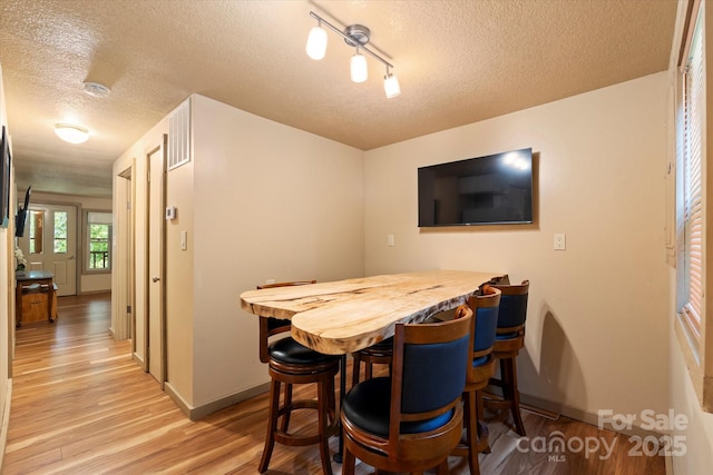 139 Ivy Ridge Church Rd, Mars Hill, NC 28754 - dining space featuring a textured ceiling and light wood-type flooring