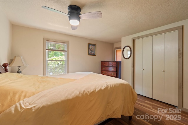 139 Ivy Ridge Church Rd, Mars Hill, NC 28754 - bedroom with wood finished floors, a closet, a textured ceiling, and a ceiling fan