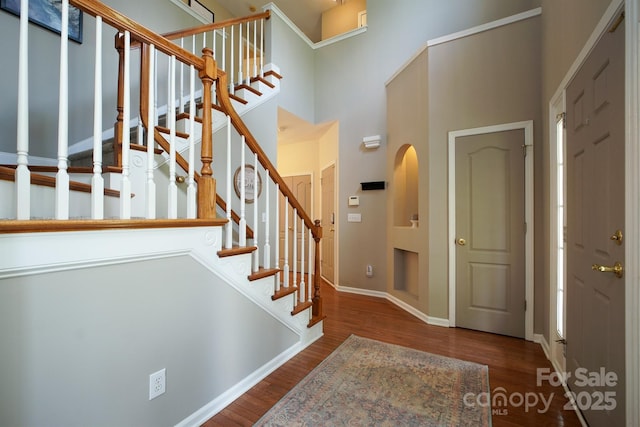 2908 Barnard Castle Ln, Matthews, NC 28104 - entryway with a towering ceiling, baseboards, wood finished floors, and stairs