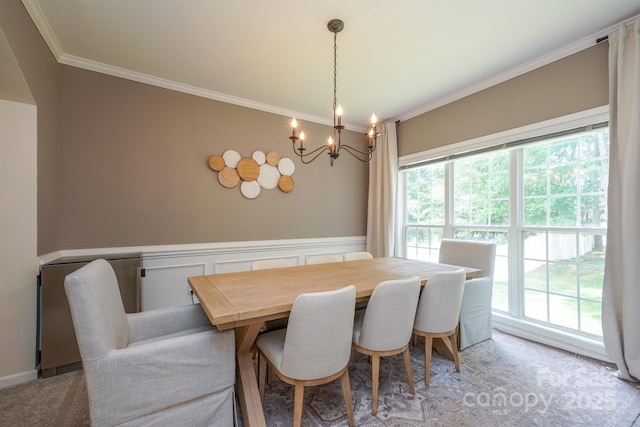 2908 Barnard Castle Ln, Matthews, NC 28104 - dining area with ornamental molding, a chandelier, and a wainscoted wall