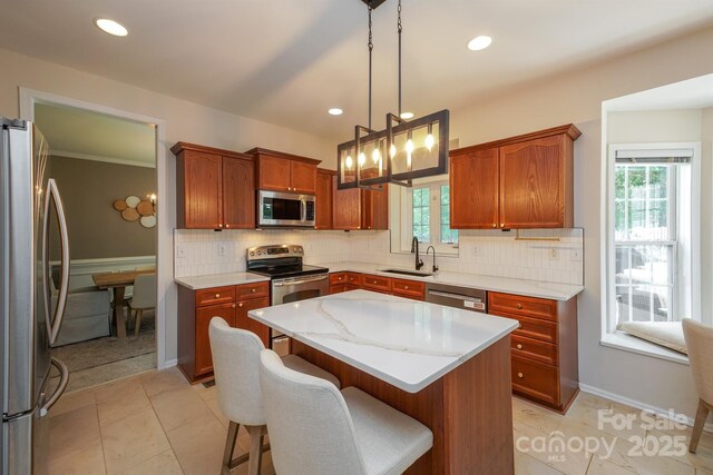 2908 Barnard Castle Ln, Matthews, NC 28104 - kitchen featuring stainless steel appliances, a sink, healthy amount of natural light, a kitchen island, and recessed lighting