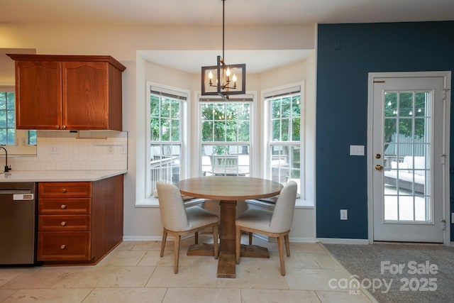 2908 Barnard Castle Ln, Matthews, NC 28104 - dining room featuring a chandelier and baseboards