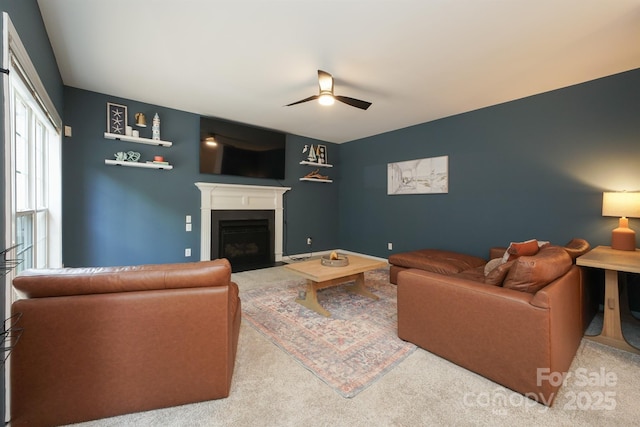 2908 Barnard Castle Ln, Matthews, NC 28104 - carpeted living room with ceiling fan and a fireplace with flush hearth