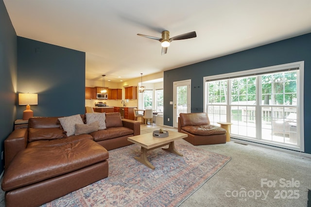 2908 Barnard Castle Ln, Matthews, NC 28104 - carpeted living room featuring a ceiling fan
