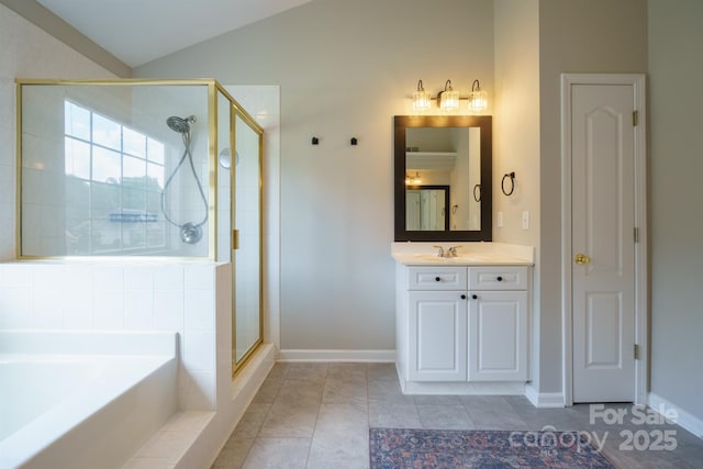 2908 Barnard Castle Ln, Matthews, NC 28104 - bathroom with a shower stall, a bath, vanity, lofted ceiling, and baseboards