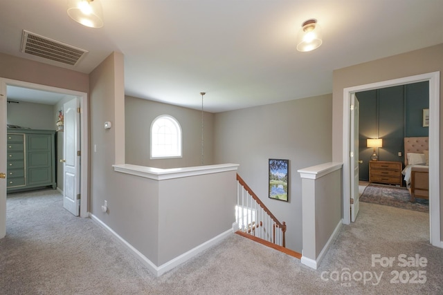 2908 Barnard Castle Ln, Matthews, NC 28104 - hallway with an upstairs landing, light carpet, and baseboards