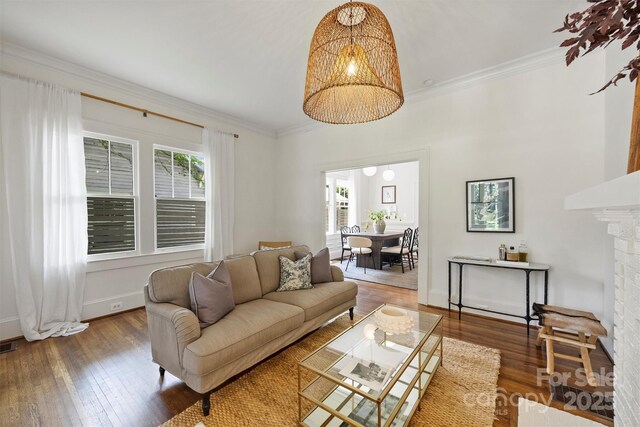 1417 The Plz, Charlotte, NC 28205 - living area featuring hardwood / wood-style floors, crown molding, and a fireplace