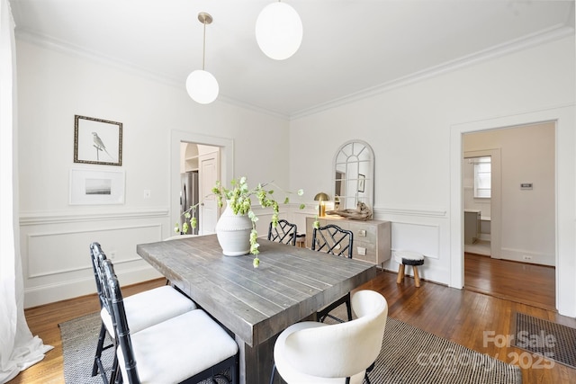 1417 The Plz, Charlotte, NC 28205 - dining space featuring ornamental molding, wood finished floors, and a decorative wall