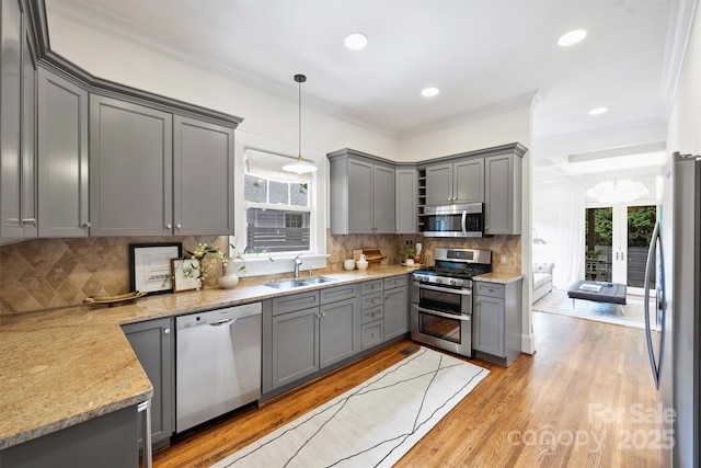 1417 The Plz, Charlotte, NC 28205 - kitchen featuring stainless steel appliances, gray cabinets, plenty of natural light, crown molding, and recessed lighting