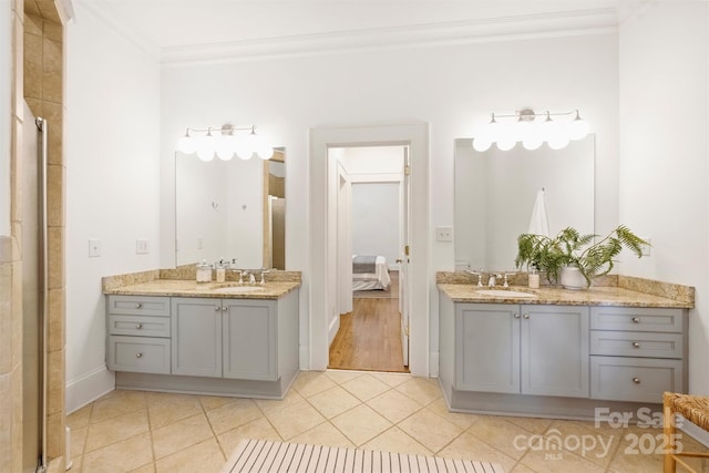 1417 The Plz, Charlotte, NC 28205 - bathroom featuring ornamental molding, two vanities, ensuite bathroom, and tile patterned floors