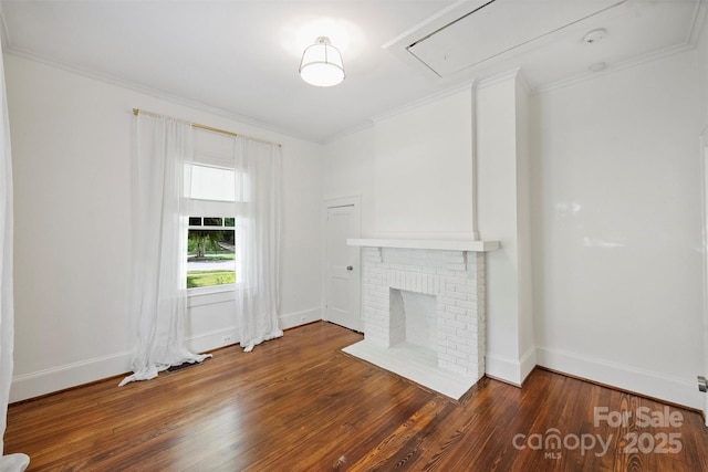 1417 The Plz, Charlotte, NC 28205 - unfurnished living room with attic access, wood finished floors, a brick fireplace, and ornamental molding