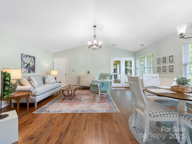 20 E Fairway View Ct, Etowah, NC 28729 - living room featuring lofted ceiling, a chandelier, and wood finished floors
