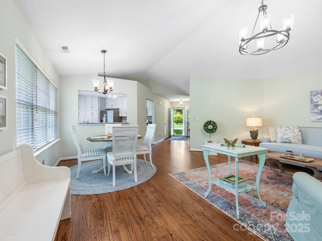 20 E Fairway View Ct, Etowah, NC 28729 - dining area with a chandelier, wood finished floors, and vaulted ceiling