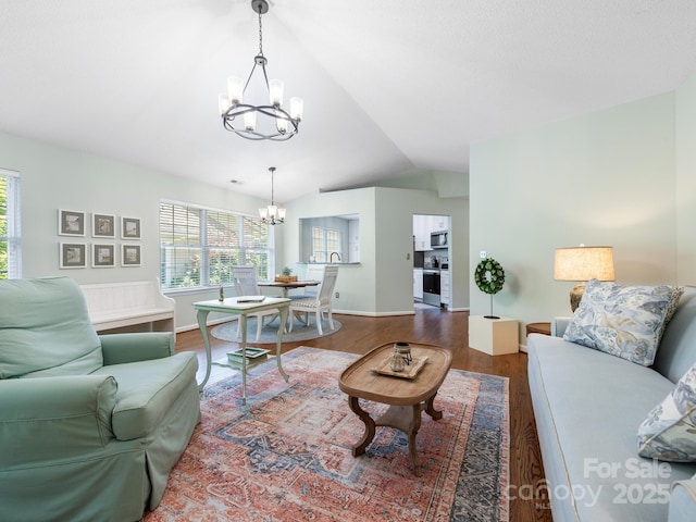 20 E Fairway View Ct, Etowah, NC 28729 - living area with a chandelier, wood finished floors, plenty of natural light, and vaulted ceiling