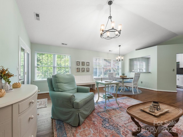 20 E Fairway View Ct, Etowah, NC 28729 - living room with a chandelier, dark wood-type flooring, and vaulted ceiling