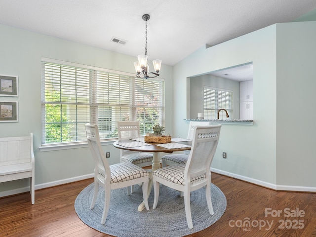 20 E Fairway View Ct, Etowah, NC 28729 - dining room with a chandelier, wood finished floors, and vaulted ceiling