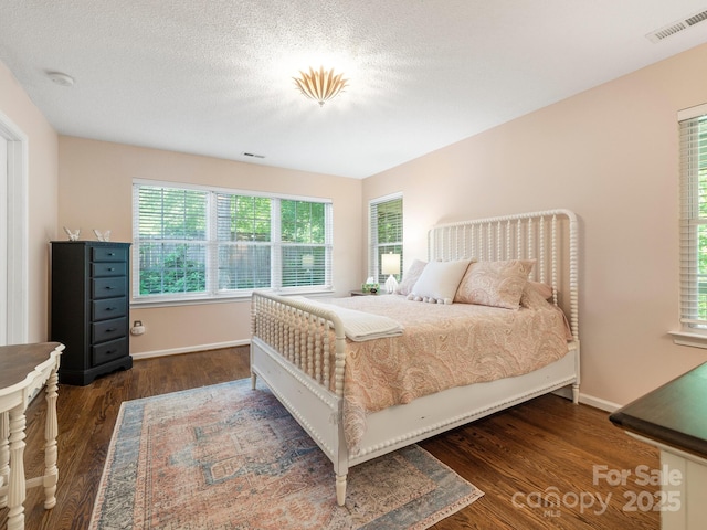 20 E Fairway View Ct, Etowah, NC 28729 - bedroom featuring wood finished floors and multiple windows