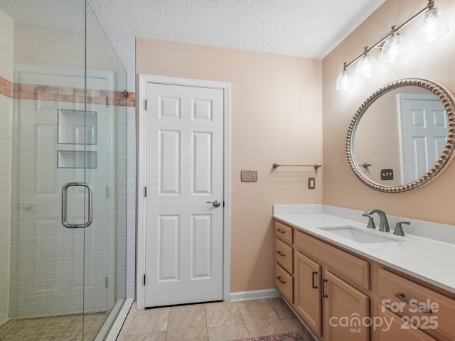 20 E Fairway View Ct, Etowah, NC 28729 - bathroom with vanity, a shower stall, and a textured ceiling