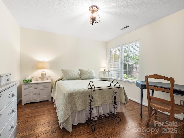 20 E Fairway View Ct, Etowah, NC 28729 - bedroom with dark wood-style flooring and a textured ceiling