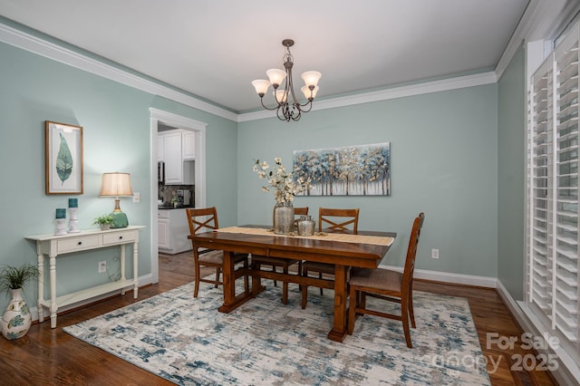 506 Academy St, Mcadenville, NC 28101 - dining room with a chandelier, wood finished floors, ornamental molding, and baseboards