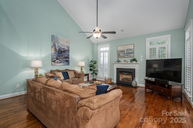 506 Academy St, Mcadenville, NC 28101 - living room with wood finished floors, plenty of natural light, a glass covered fireplace, a ceiling fan, and high vaulted ceiling