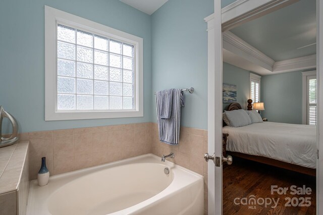 506 Academy St, Mcadenville, NC 28101 - ensuite bathroom with a bath, ornamental molding, and wood finished floors