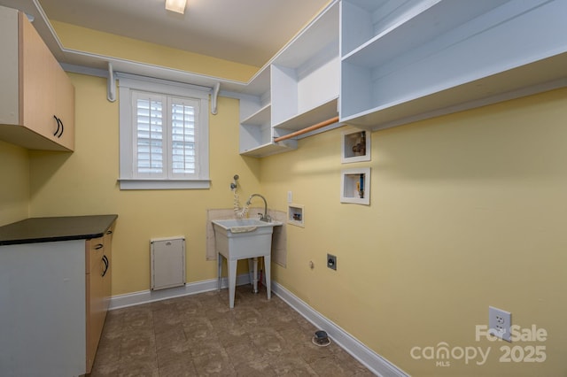 506 Academy St, Mcadenville, NC 28101 - washroom featuring cabinet space, hookup for a washing machine, hookup for an electric dryer, and baseboards