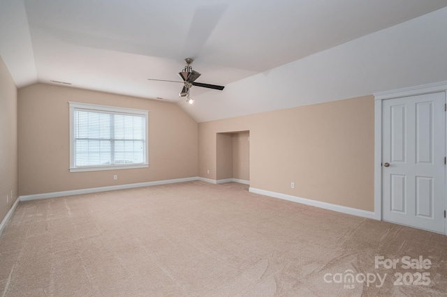506 Academy St, Mcadenville, NC 28101 - unfurnished bedroom featuring vaulted ceiling, baseboards, light carpet, and a ceiling fan