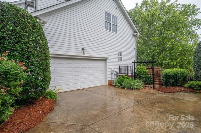 506 Academy St, Mcadenville, NC 28101 - view of side of property featuring driveway and an attached garage