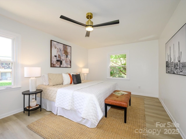 4754 Hedgemore Dr Unit E, Charlotte, NC 28209 - bedroom featuring light wood-style flooring and ceiling fan
