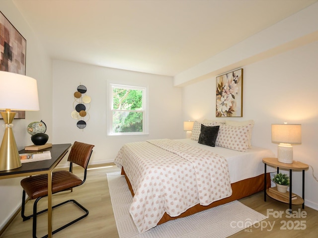 4754 Hedgemore Dr Unit E, Charlotte, NC 28209 - bedroom with light wood-style floors and a desk