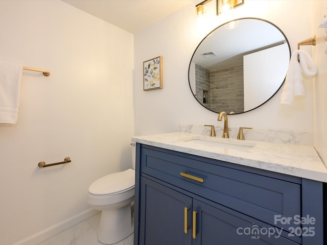 4754 Hedgemore Dr Unit E, Charlotte, NC 28209 - bathroom featuring marble look tile flooring and vanity