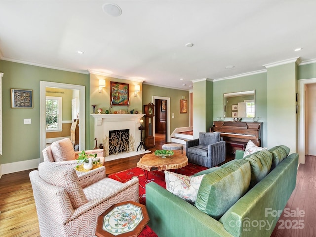 2526 Sherwood Ave, Charlotte, NC 28207 - living area with healthy amount of natural light, wood finished floors, baseboards, recessed lighting, and ornamental molding