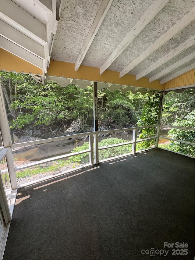 232 Cole Hollow Rd, Newland, NC 28657 - unfurnished sunroom with beamed ceiling