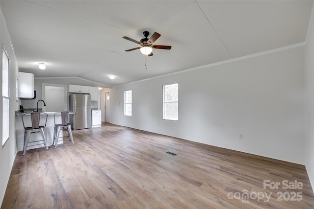 976 Neely Store Rd, Rock Hill, SC 29730 - unfurnished living room with a ceiling fan, lofted ceiling, light wood-style floors, ornamental molding, and a sink
