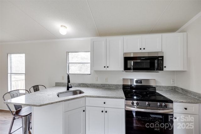 976 Neely Store Rd, Rock Hill, SC 29730 - kitchen featuring appliances with stainless steel finishes, a sink, white cabinetry, crown molding, and plenty of natural light
