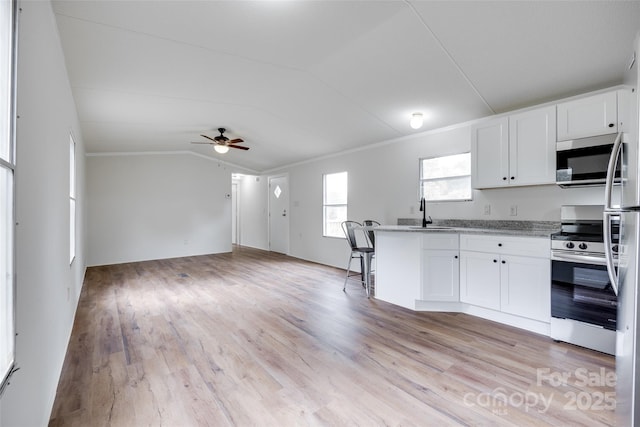 976 Neely Store Rd, Rock Hill, SC 29730 - kitchen featuring stainless steel appliances, ceiling fan, vaulted ceiling, white cabinetry, and open floor plan
