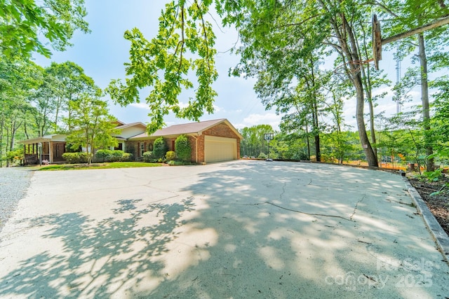 12705 Caldwell Rd, Charlotte, NC 28213 - ranch-style home featuring brick siding, driveway, and an attached garage
