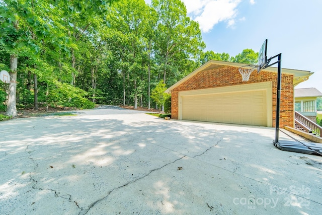 12705 Caldwell Rd, Charlotte, NC 28213 - view of side of home with a garage and brick siding