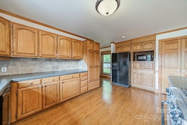12705 Caldwell Rd, Charlotte, NC 28213 - kitchen with black appliances, light wood-style flooring, tasteful backsplash, brown cabinetry, and ornamental molding